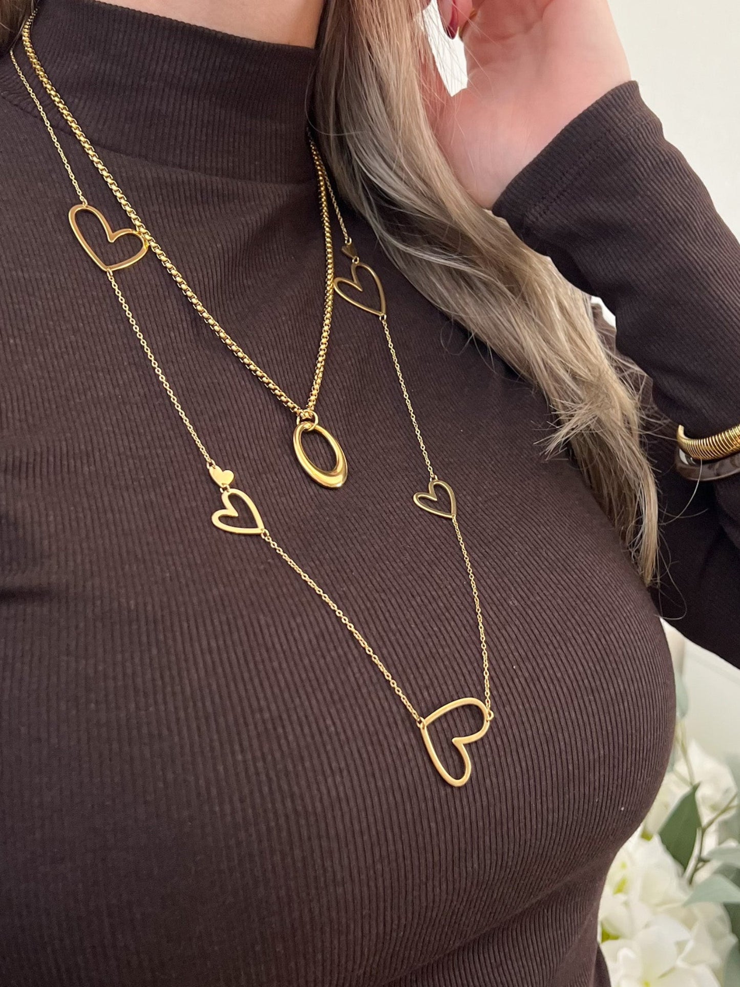Lange ketting met open en dichte hartjes