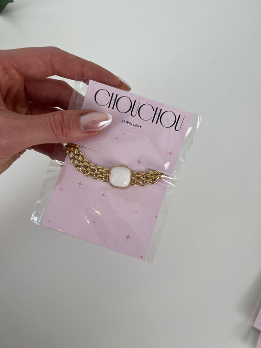 Platte schakelarmband met gekleurde steen