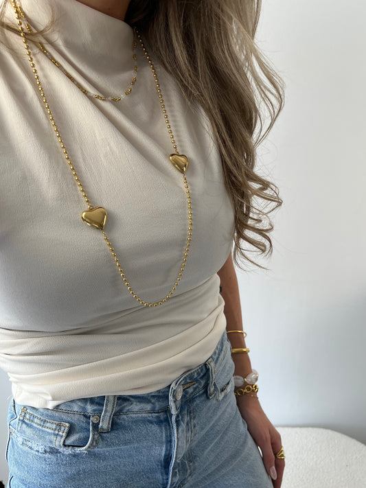 Lange ketting met balletjes en 2 hartjes